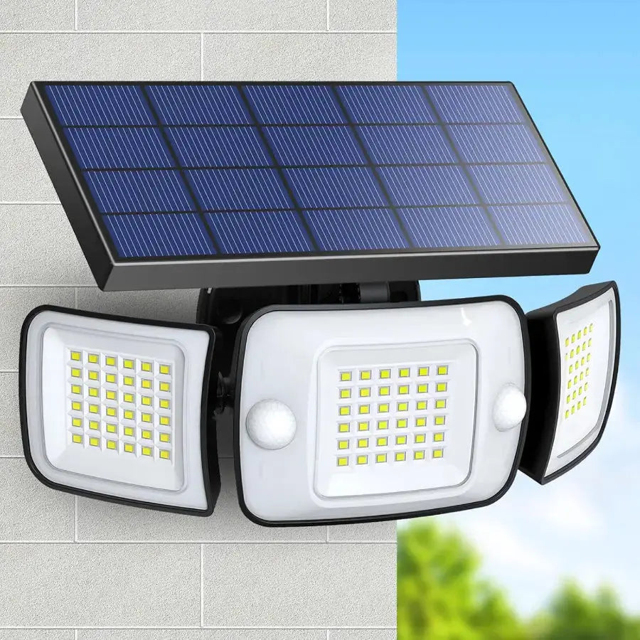 Intelamp solar flood light with 270-degree wide-angle coverage, featuring three adjustable heads and dual motion sensors, mounted on an exterior brick wall under a clear blue sky