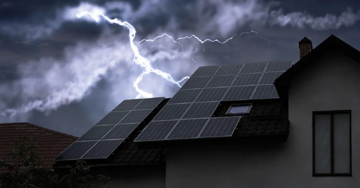 Rooftop solar panels during a dark, stormy night with lightning in the sky, raising the question of whether solar lights can still charge on cloudy days.