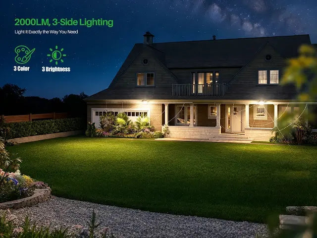 Ultra-bright 2000LM solar flood light with a 3-sided design casting wide-angle, even illumination across a large residential lawn and backyard patio.