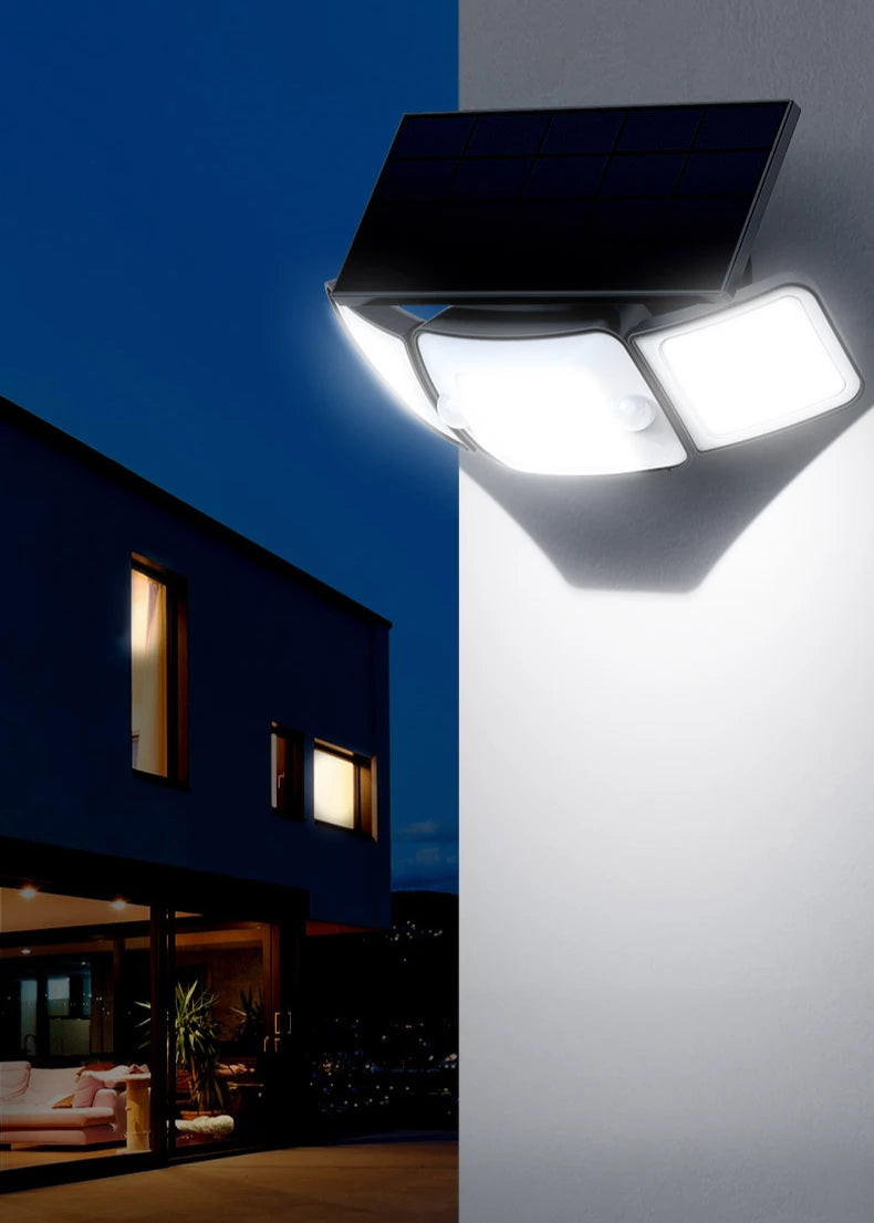 Vertical view intelamp 3‑head adjustable solar outdoor security flood light, dual motion‑sensor wide‑angle solar light installed at modern residential building exterior